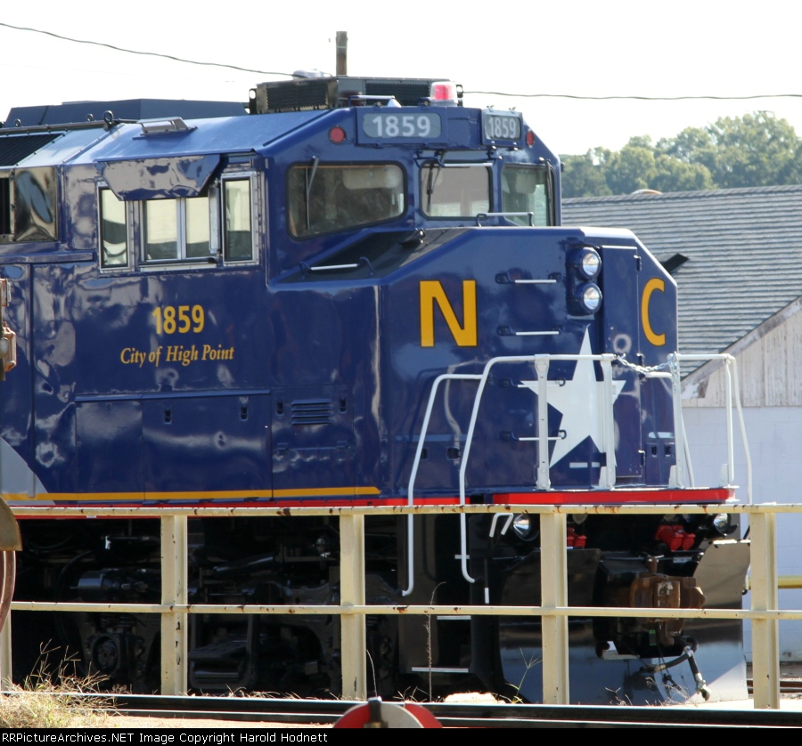 RNCX 1859 sits behind the fueling racks in the NS yard